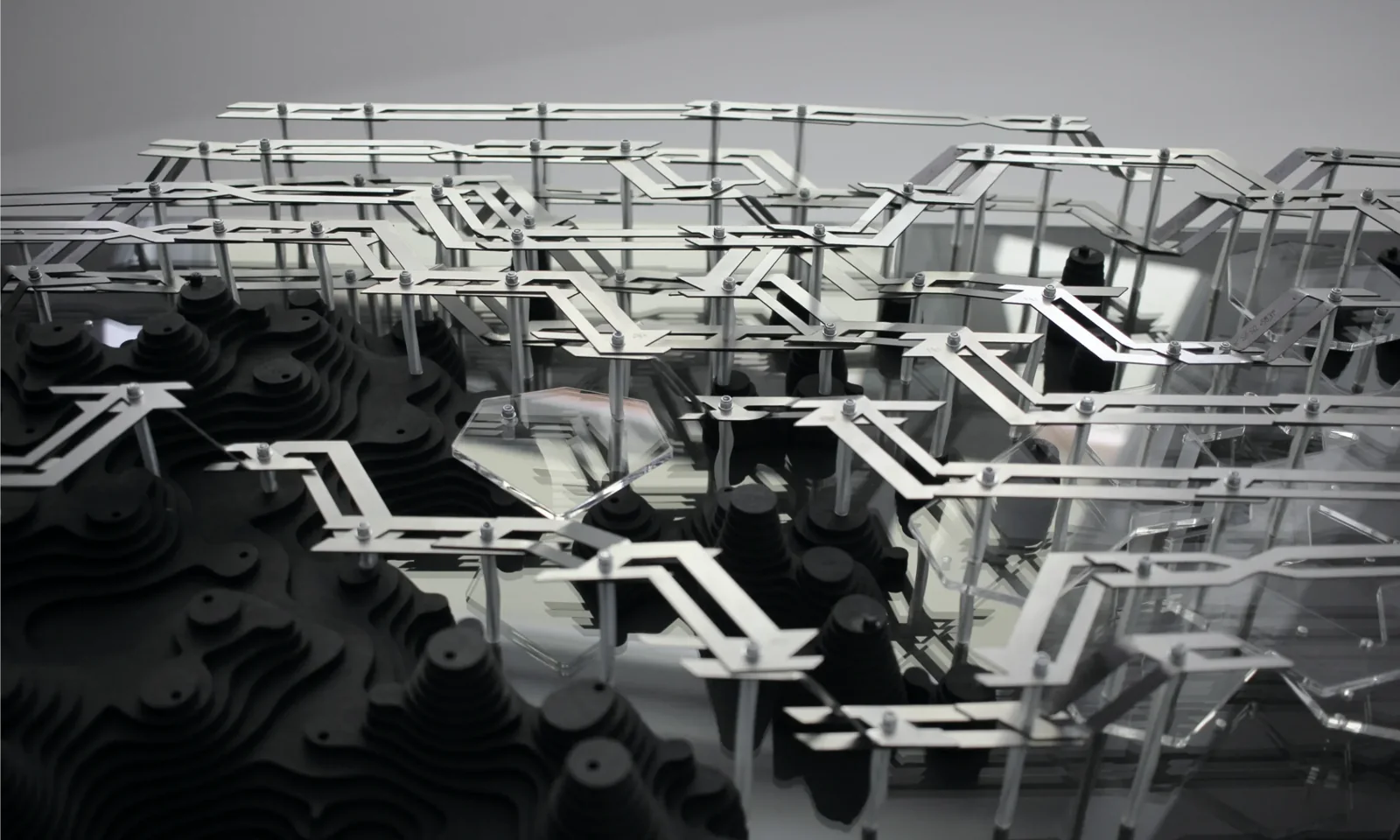 Physical prototype with stacked plywood wood modules and metal framework viewed from above