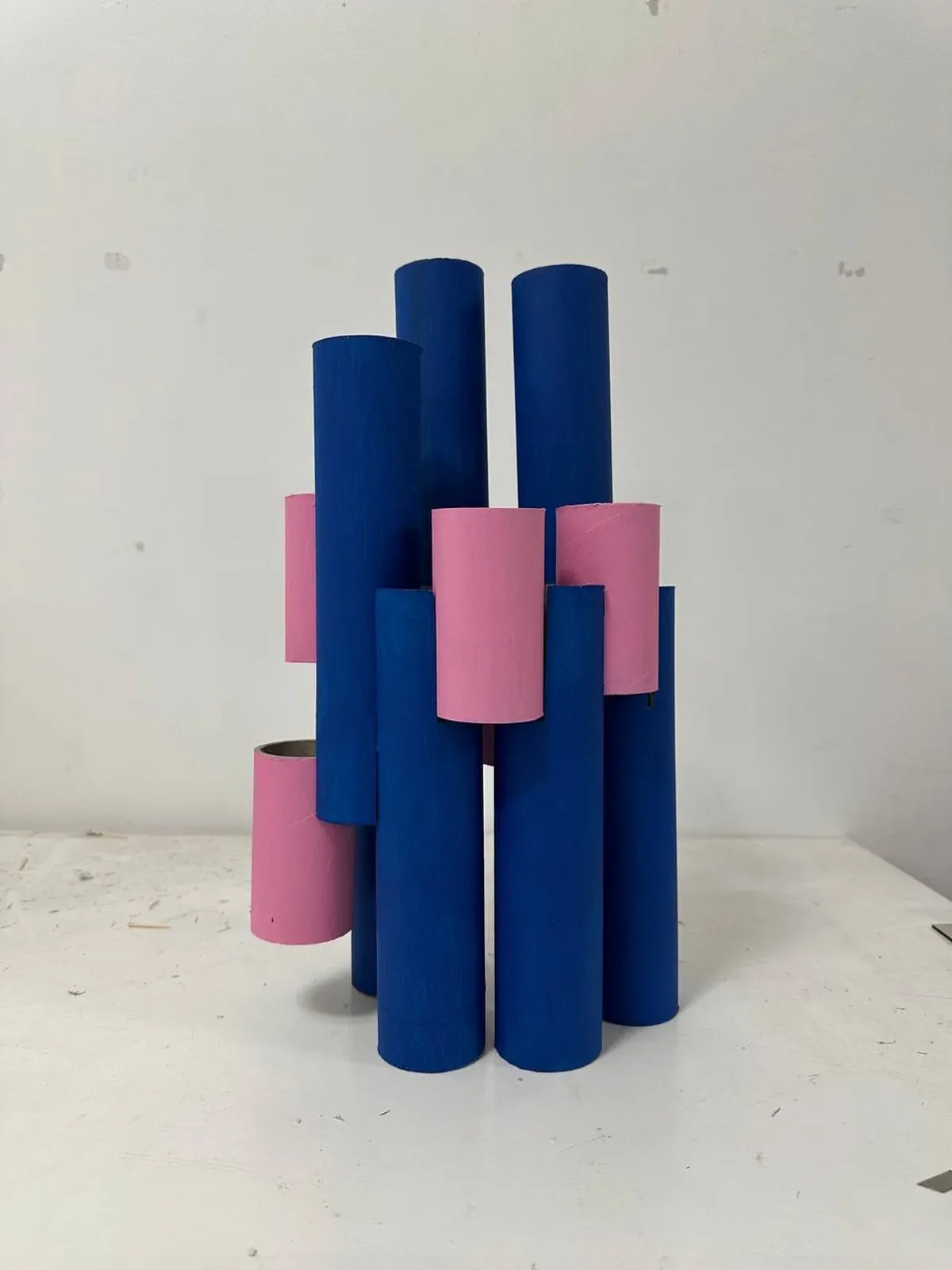 Physical model in blue and pink cardboard tubes
