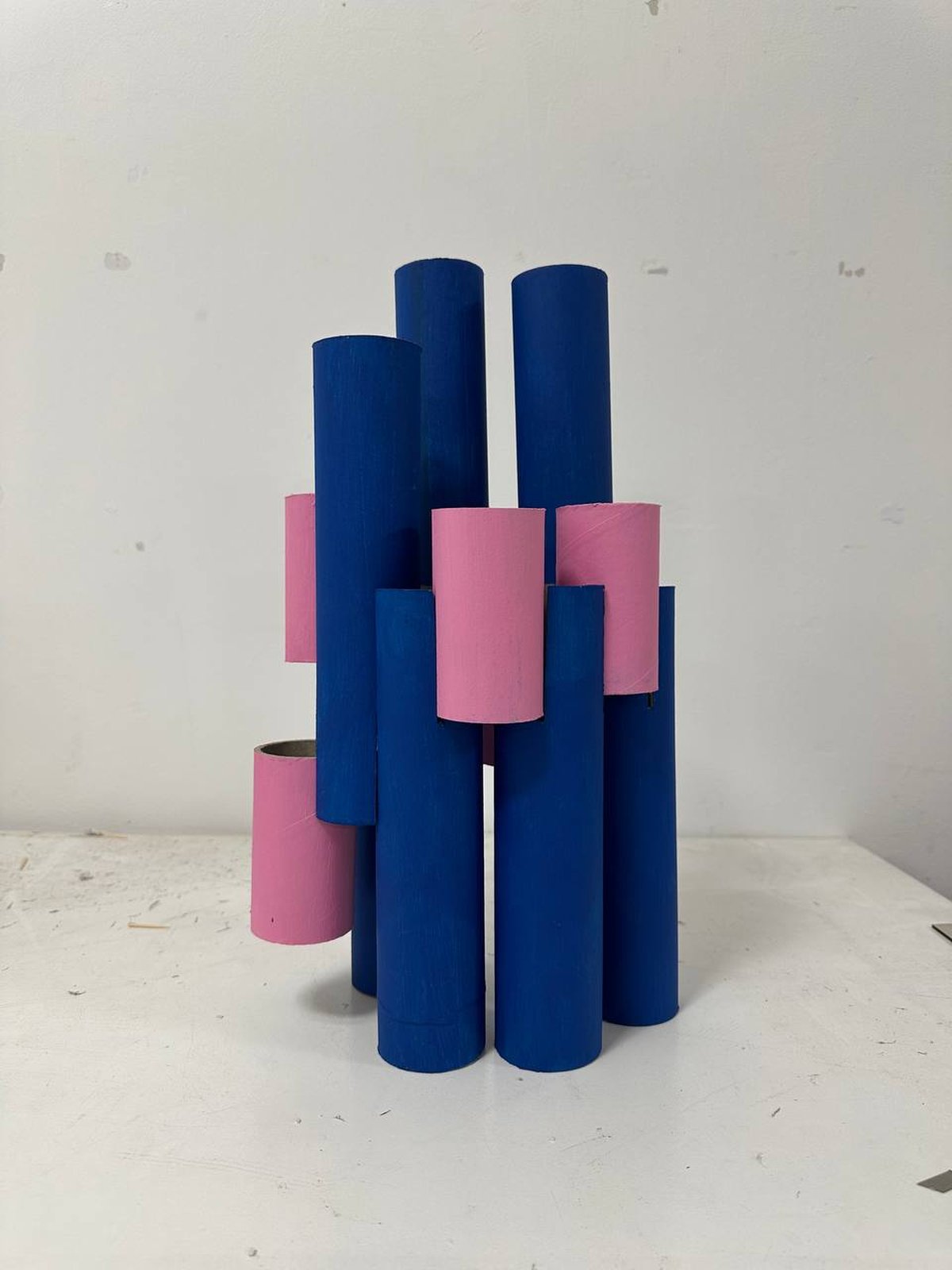Physical model in blue and pink cardboard tubes